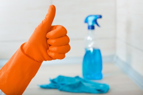 Cleaner preparing a newly renovated office space in W1J after building work