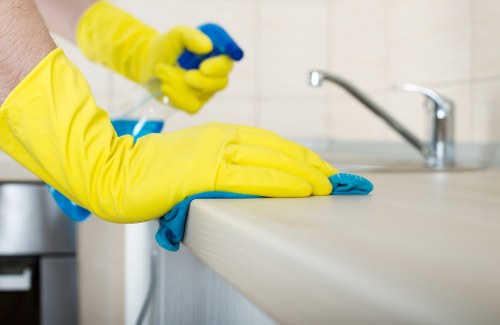 Local cleaner preparing a guest-ready bedroom in W1J